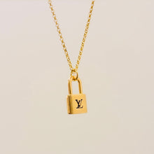 Load image into Gallery viewer, Authentic repurposed Louis Vuitton logo lock necklace - medium size
