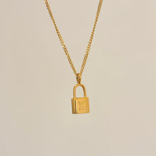 Load image into Gallery viewer, Authentic repurposed Louis Vuitton logo lock necklace
